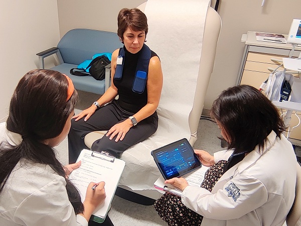 Adaptive deep brain stimulation patient meets with providers