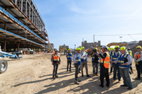 Photo of people touring Destination Grand construction site in Detroit.