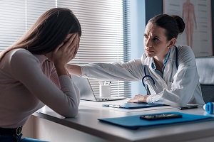 Stock image of doctor consoling patient