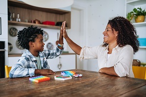 Woman playing with child with autism